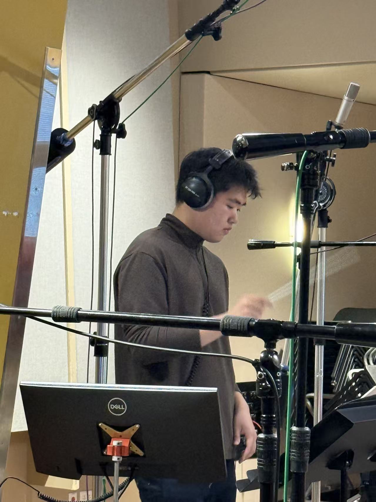 Ziheng Wang working in a recording studio